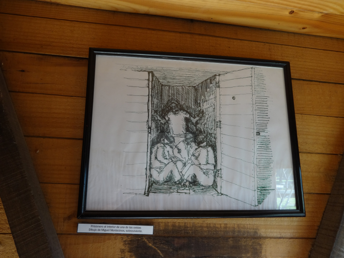 photo of drawing of prisoners confined to small shack